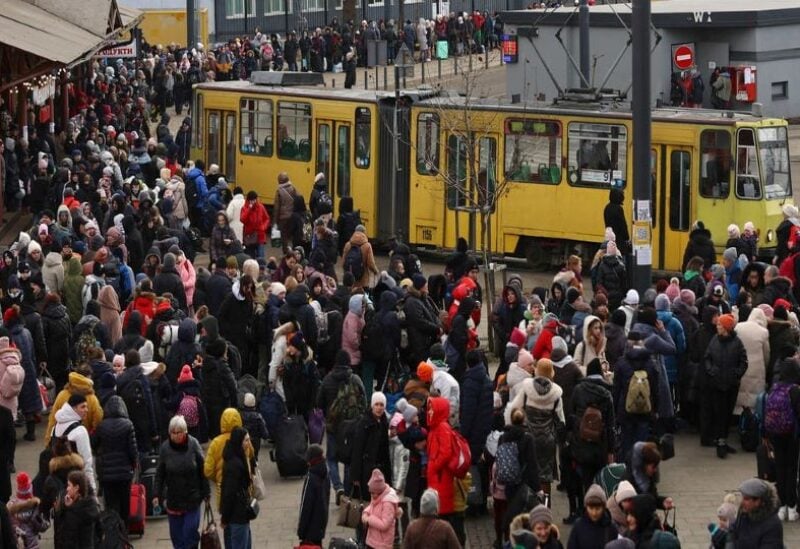 Refugees fleeing the ongoing Russian invasion of Ukraine wait for hours to board a train to Poland,