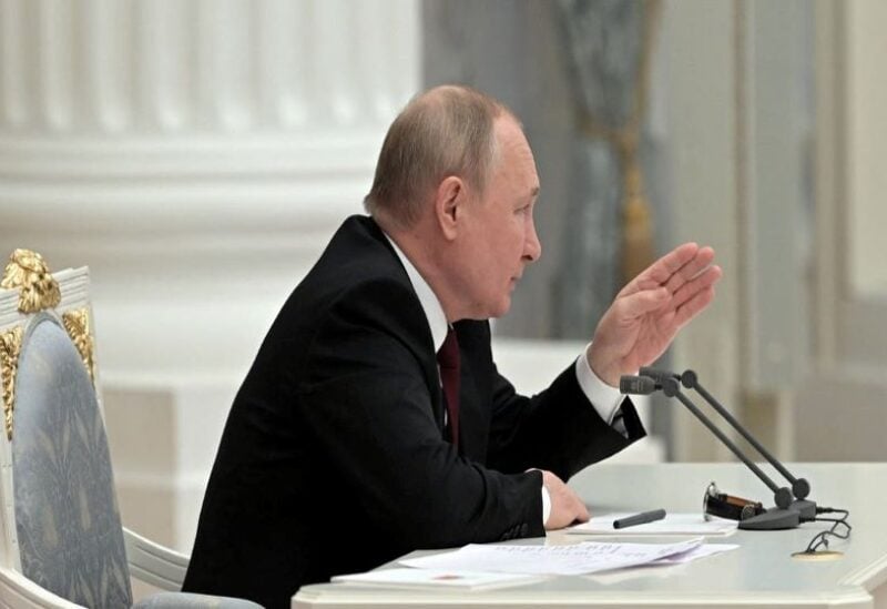 Russian President Vladimir Putin chairs a meeting with members of the Security Council in Moscow