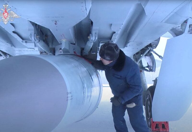 An airman checks a Russian Air Force MiG-31 fighter jet