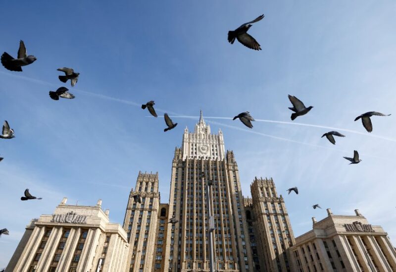 Pigeons fly in front of the headquarters of the Russian Foreign Ministry in Moscow, Russia October 12, 2021.