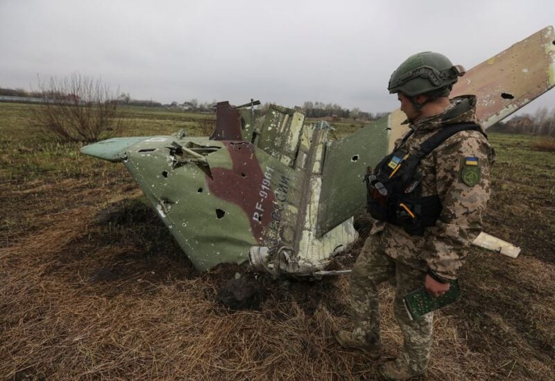 A military sapper inspects remains of a Russian Sukhoi Su-25 fighting aircraft hit by Ukrainian Armed Forces during Russia's invasion in Kyiv Region, Ukraine April 21, 2022. REUTERS/Mykola Tymchenko