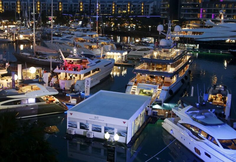A Ferretti booth sits among yachts on display at the Singapore Yacht Show on Sentosa Island April 25, 2015. Picture taken April 25, 2015. REUTERS/Edgar Su