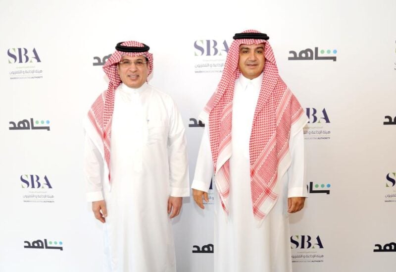 CEO of Saudi Arabia's Radio and Television Corporation, Mohammed Fahad al-Harthi, and MBC Chairman Sheikh Waleed Al Ibrahim sign a strategic partnership. (Twitter)