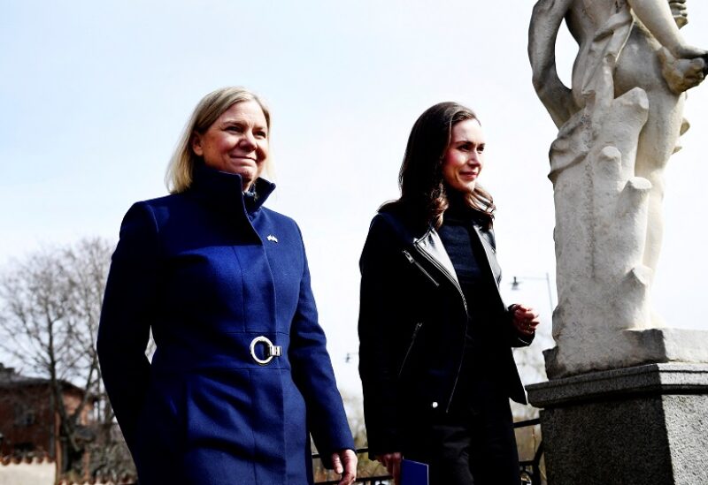 Sweden's Prime Minister Magdalena Andersson walks with Finland's Prime Minister Sanna Marin prior to a meeting, amid Russia's invasion of Ukraine, in Stockholm, Sweden, April 13, 2022. Paul Wennerholm/TT News Agency/via REUTERS ATTENTION EDITORS - THIS IMAGE WAS PROVIDED BY A THIRD PARTY. SWEDEN OUT. NO COMMERCIAL OR EDITORIAL SALES IN SWEDEN.