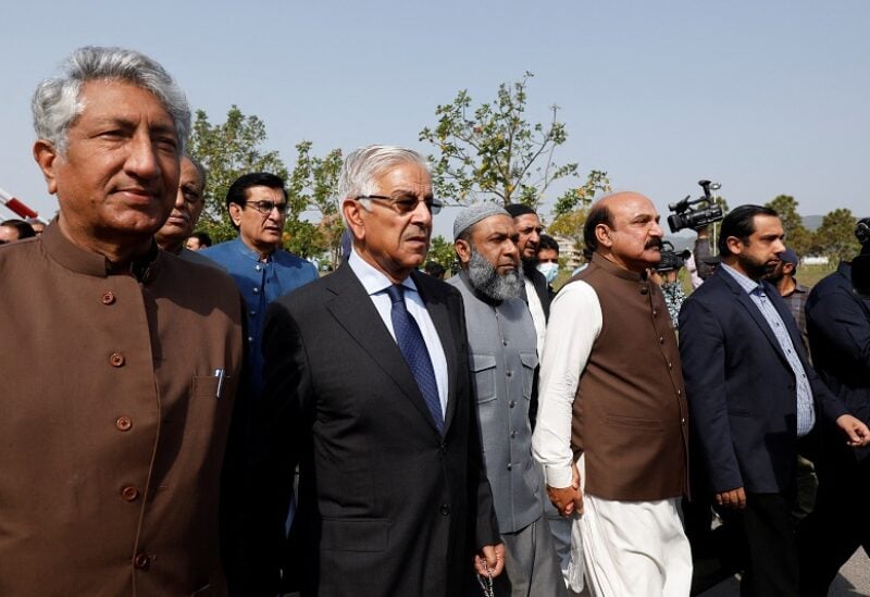 Pakistani lawmakers of the united opposition walk towards the parliament house building to cast their vote on a motion of no-confidence to oust PM Imran Khan, in Islamabad,