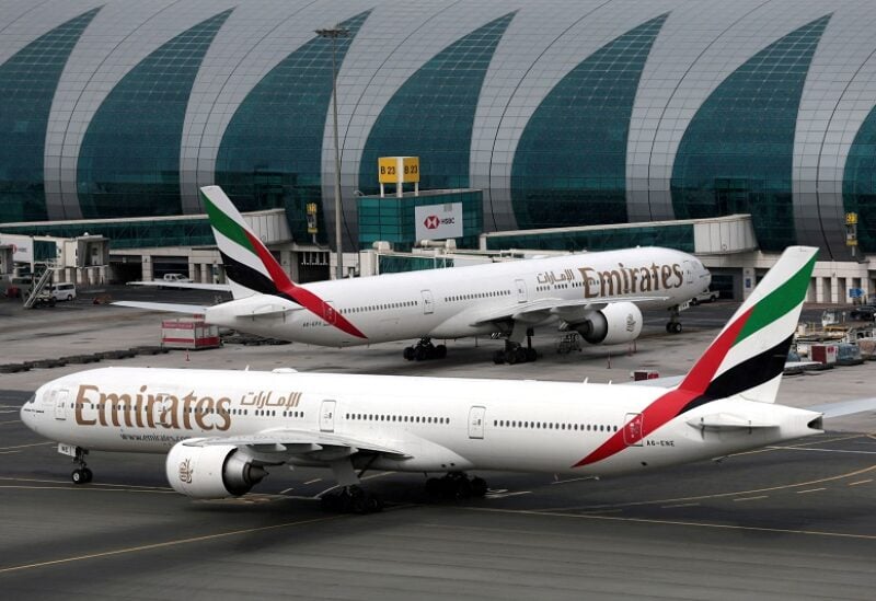 FILE PHOTO: Emirates Airline Boeing 777-300ER planes are seen at Dubai International Airport in Dubai, United Arab Emirates, February 15, 2019. REUTERS/Christopher Pike/File Photo