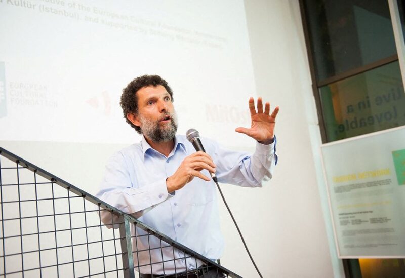 Turkish philanthropist Osman Kavala, accused of attempting to overthrow the government and jailed since late 2017 without a conviction, speaks during an event in this undated handout photo. Anadolu Kultur/Handout via REUTERS