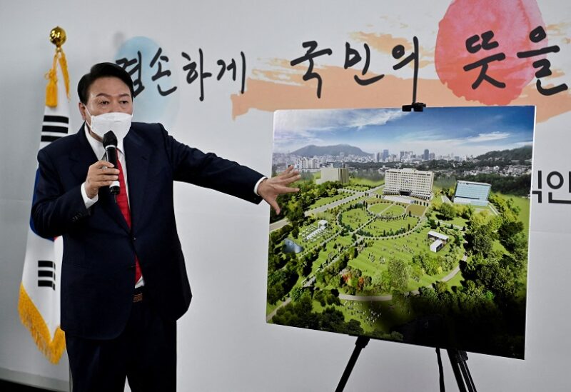 FILE PHOTO: South Korea's president-elect Yoon Suk-yeol shows a bird's eye view of his planned relocation of the presidential office during a news conference, at his transition team office, in Seoul, South Korea, March 20, 2022.Jung Yeon-je/Pool via REUTERS/File Photo