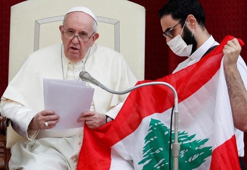 Pope Francis next to the Lebanese flag