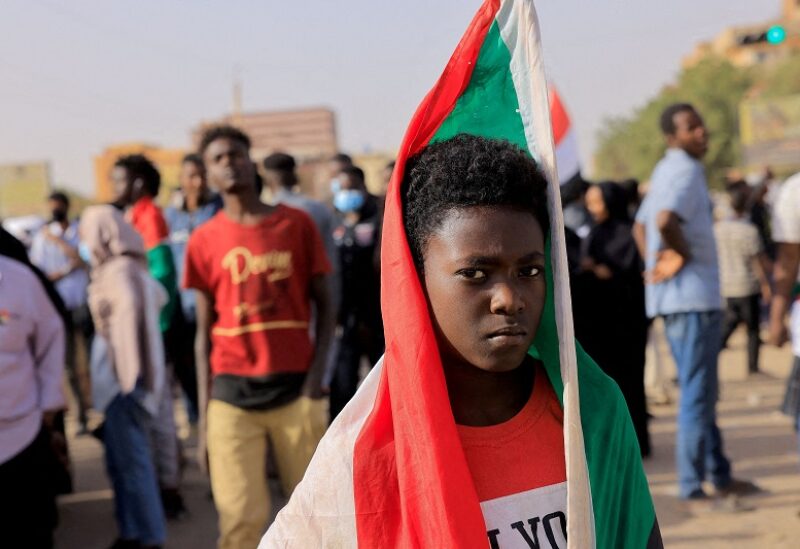 FILE PHOTO: A protester marches during a rally against military rule in Khartoum, Sudan, February 10, 2022. Reuters/Mohamed Nureldin Abdallah/File Photo