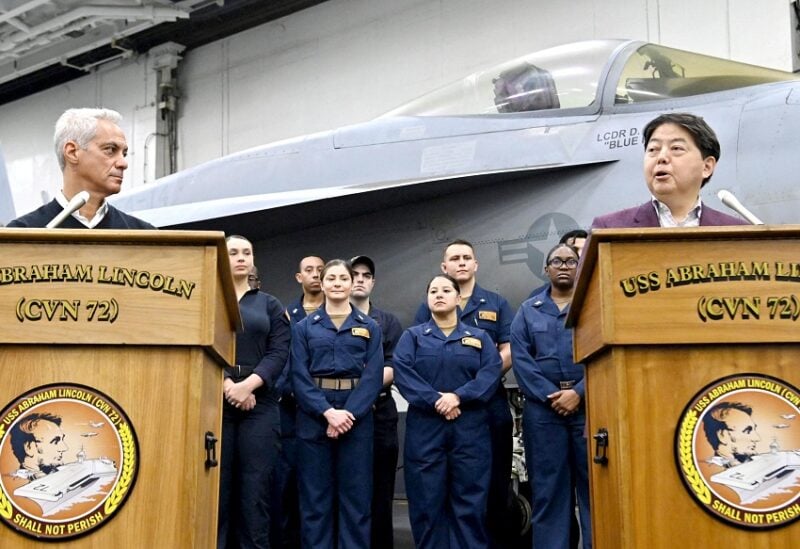Japan's Foreign Minister Yoshimasa Hayashi speaks during a joint news conference with U.S. Ambassador to Japan Rahm Emanuel while they visit U.S. Navy aircraft carrier Abraham Lincoln in waters close to Japan in this photo distributed by Kyodo on April 23, 2022. Mandatory credit Kyodo/via REUTERS