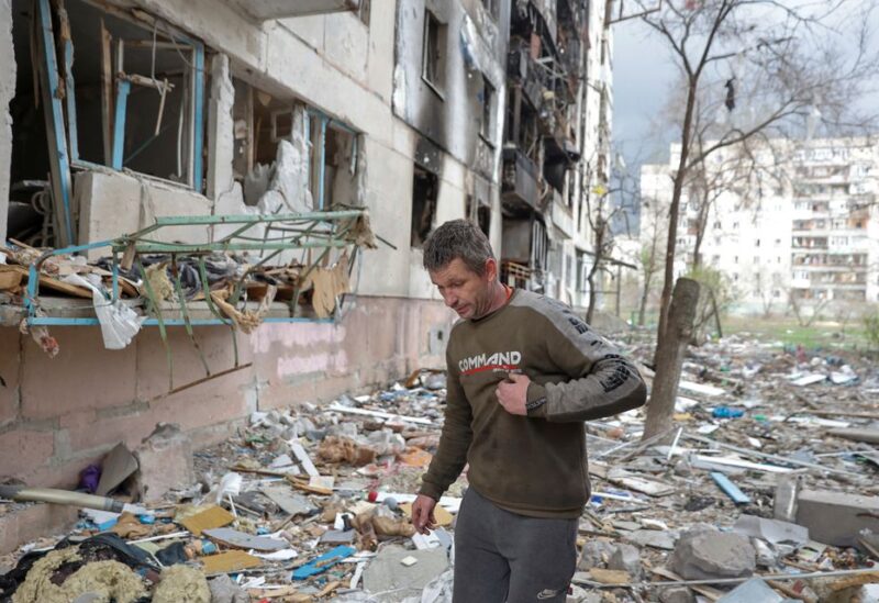 Local resident Viacheslav walks on debris of a residential building damaged by a military strike, as Russia's attack on Ukraine continues, in Sievierodonetsk, Luhansk region, Ukraine April 16, 2022. REUTERS/Serhii Nuzhnenko