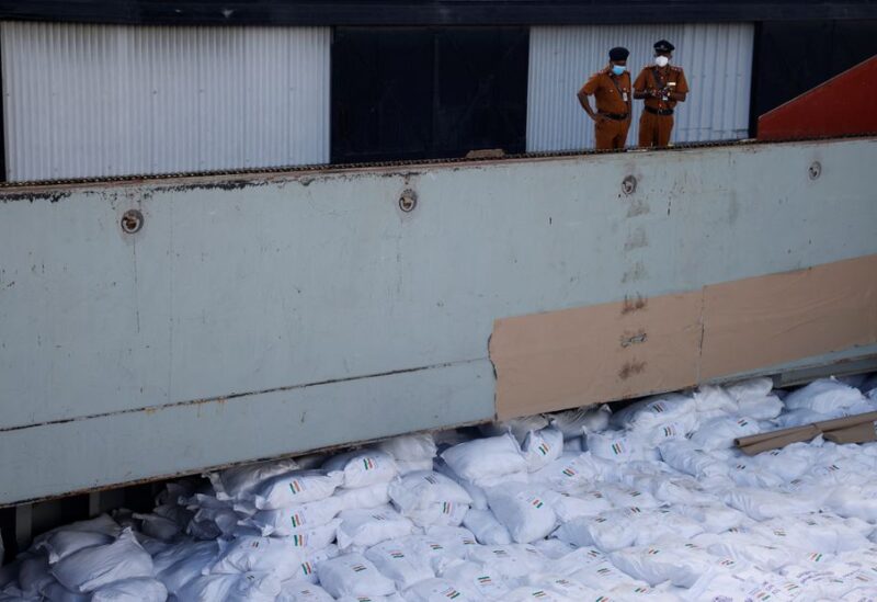 Members of security personnel stand on a cargo ship carrying essential supplies of rice, milk and some critically needed medicines from India, amid Sri Lanka's economic crisis, at a port in Colombo, Sri Lanka, May 22, 2022. Picture taken on May 22, 2022. REUTERS/Adnan Abidi