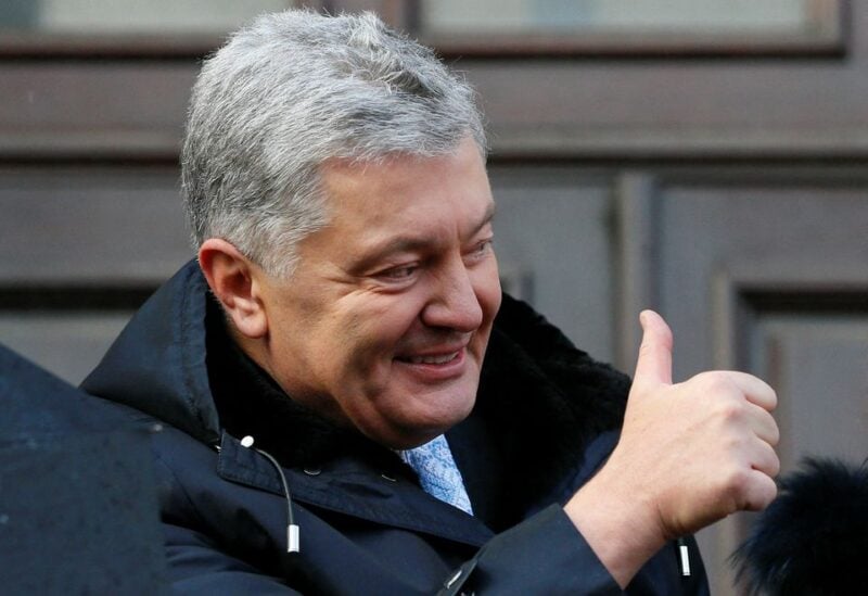 Ukrainian former President Petro Poroshenko, who is suspected of high treason by financing pro-Russian separatists in eastern Ukraine while in office in 2014-2015, gives a thumbs-up as he greets his supporters after a court hearing in Kyiv, Ukraine January 19, 2022. REUTERS/Gleb Garanich