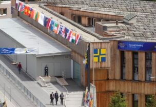 People walk past the congress center, the venue of the World Economic Forum 2022 (WEF) in the Alpine resort of Davos, Switzerland May 22, 2022. REUTERS/Arnd Wiegmann