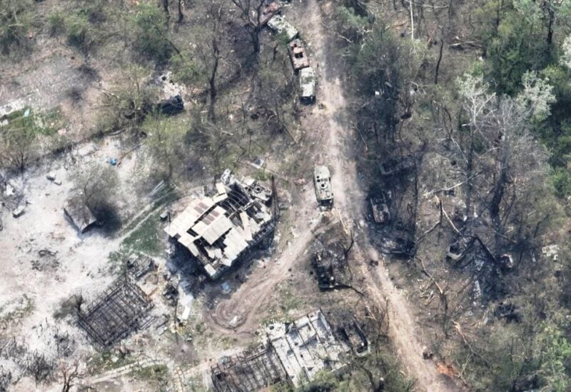 An aerial view of destroyed buildings and burnt vehicles on the banks of Siverskyi Donets River, eastern Ukraine, in this handout image uploaded on May 12, 2022. Ukrainian Airborne Forces Command/Handout via REUTERS