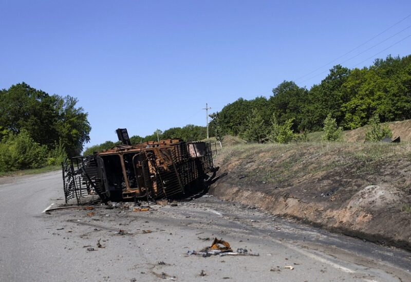 A destroyed combat vehicle is pictured on the road in Staryi Saltiv, a village retaken by Ukrainian forces, amid Russia's attack on Ukraine, in Kharkiv region, Ukraine, May 20, 2022. REUTERS/Ricardo Moraes