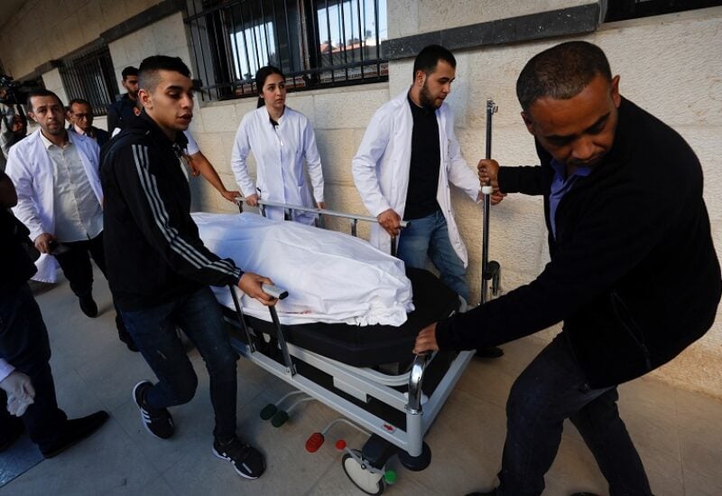 The body of Al Jazeera reporter Shireen Abu Akleh is carried on a stretcher at a hospital following an Israeli raid, in Jenin in the Israeli-occupied West Bank May 11, 2022. REUTERS/Mohamad Torokman