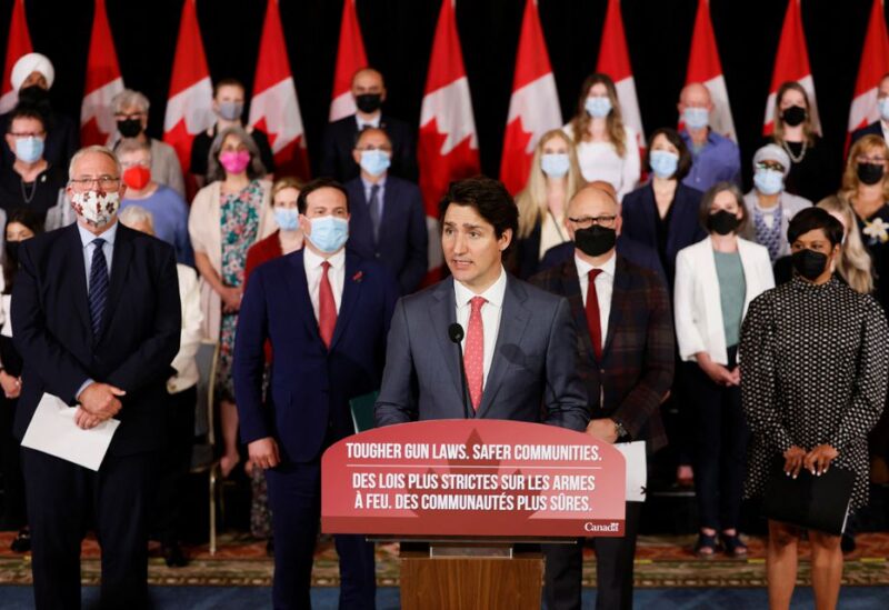 Canada's Prime Minister Justin Trudeau, with government officials and gun-control advocates, speaks at a news conference about firearm-control legislation that was tabled today in the House of Commons in Ottawa, Ontario, Canada May 30, 2022. REUTERS
