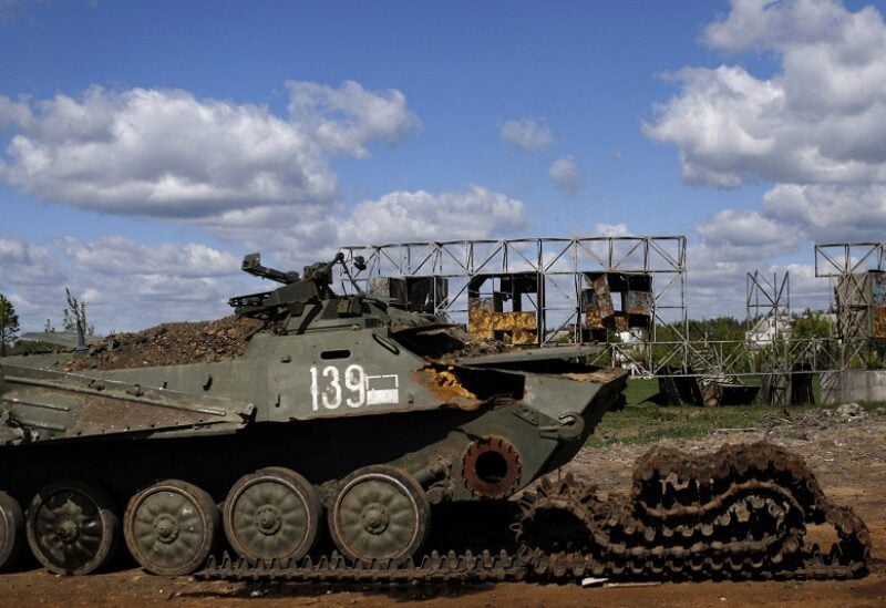 A destroyed combat vehicle is pictured on the road which connects Kharkiv and a village recently retaken by the Ukrainian Army, amid Russia's attack on Ukraine, near Kharkiv, Ukraine, May 13, 2022. REUTERS/Ricardo Moraes