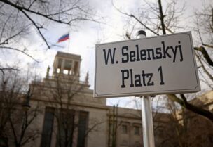 FILE PHOTO: A sign with the name of Ukraine's President Volodymyr Zelenskiy is set up in front of the Russian embassy, as Russia's invasion of Ukraine continues, in Berlin, Germany April 5, 2022. REUTERS/Lisi Niesner/File Photo