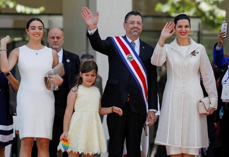 Rodrigo Chaves waves with his daughters, Tatiana Chaves, Isabella Chaves, and his wife Signe Zeicate after his swearing-in ceremony as Costa Rica's new President outside the Legislative Assembly building, in San Jose, Costa Rica May 8, 2022. REUTERS/Monica Quesada NO RESALES. NO ARCHIVES