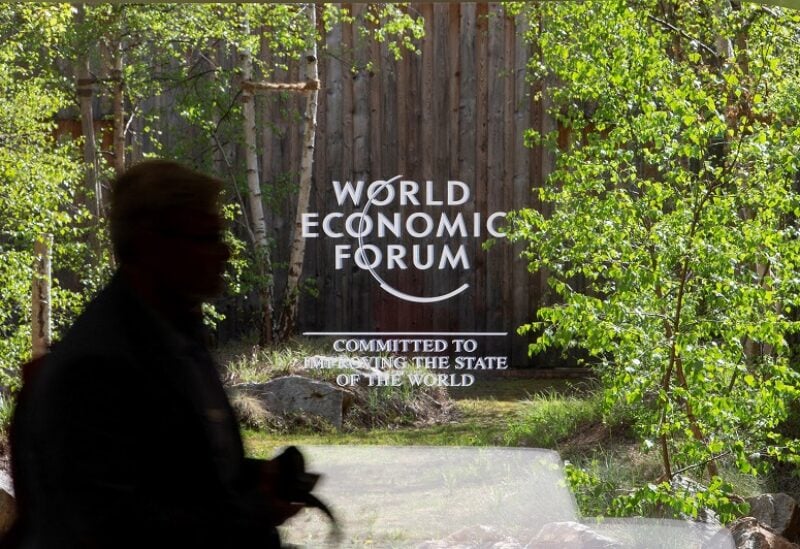 FILE PHOTO: The logo of the upcoming World Economic Forum 2022 (WEF) is pictured on a window at the congress center, in the Alpine resort of Davos, Switzerland May 21, 2022. REUTERS/Arnd Wiegmann/File Photo