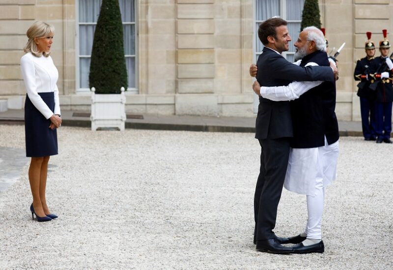 France's President Emmanuel Macron, accompanied by his wife Brigitte Macron, welcomes India's Prime Minister Narendra Modi before a meeting at the Elysee Palace in Paris, France May 4, 2022. REUTERS/Gonzalo Fuentes TPX IMAGES OF THE DAY