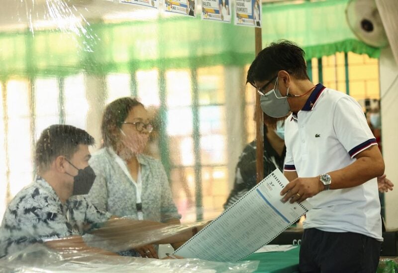 Presidential aspirant Ferdinand "Bongbong" Marcos Jr., the son and namesake of the late dictator, casts his vote in the 2022 national elections at Mariano Marcos Memorial Elementary School, in Batac, Ilocos Norte, Philippines, May 9, 2022. REUTERS/Eloisa Lopez