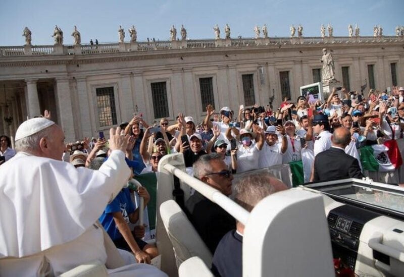 Pope Francis greets people as he arrives for the weekly general audience at the Vatican June 22, 2022. Vatican Media/­Handout via REUTERS