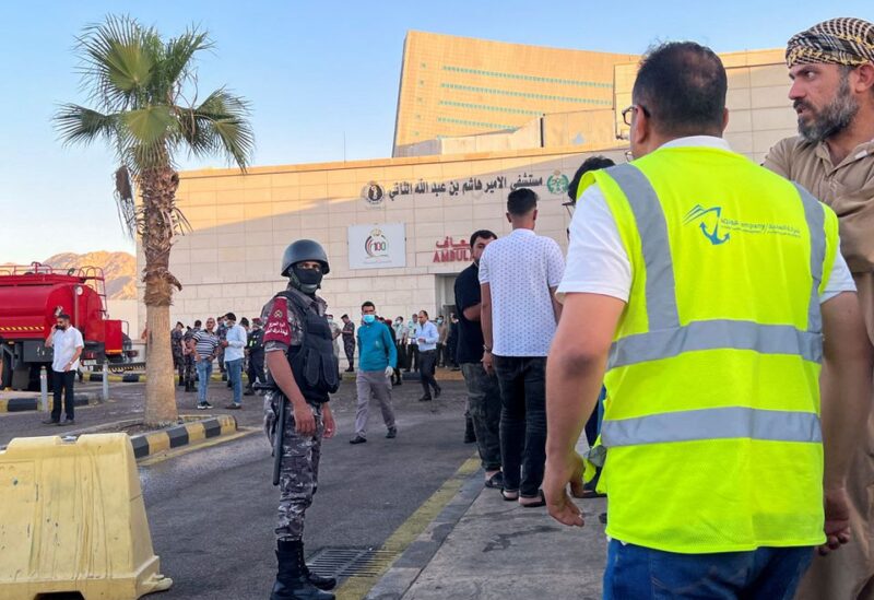People stand outside a hospital after toxic gas leak from a storage tank in Jordan's Aqaba port, Jordan June 27, 2022. REUTERS/Abraham Farajian