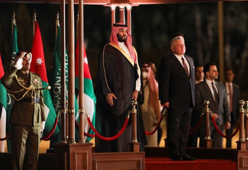 Jordan's King Abdullah II stands next to Saudi Crown Prince Mohammed bin Salman as he welcomes him at Queen Alia International Airport in Amman, Jordan June 21, 2022. REUTERS/Alaa Al Sukhni