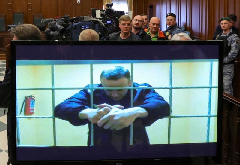 Russian opposition leader Alexei Navalny is seen on a screen via a video link from the IK-2 corrective penal colony in Pokrov during a court hearing to consider an appeal against his prison sentence in Moscow, Russia May 24, 2022. REUTERS/Evgenia Novozhenina/File Photo