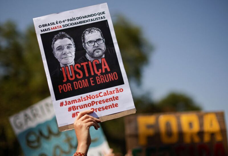 People take part in a protest to demand justice for journalist Dom Phillips and indigenous expert Bruno Pereira, who were murdered in the Amazon, in Brasilia, Brazil June 19, 2022. REUTERS/Ueslei Marcelino