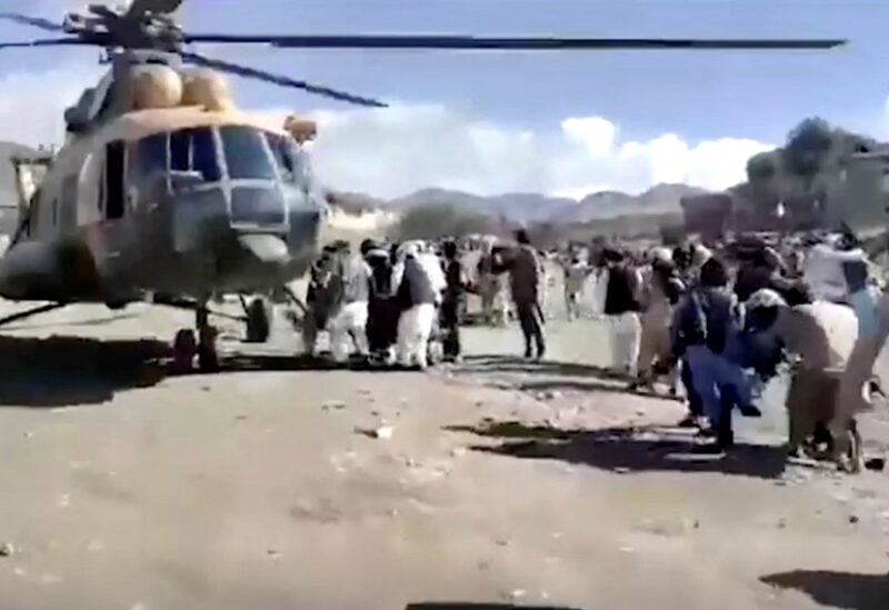 People carry injured to a helicopter following a massive earthquake, in Paktika Province, Afghanistan, June 22, 2022, in this screen grab taken from a video. BAKHTAR NEWS AGENCY/Handout via REUTERS