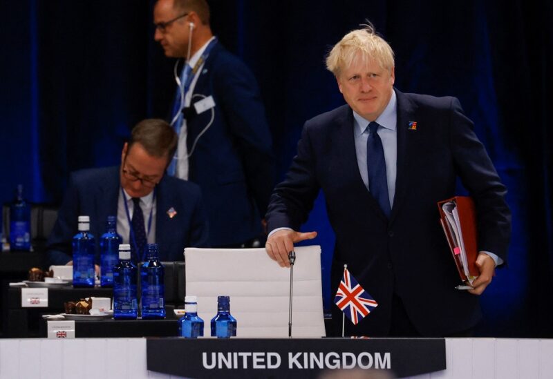 British Prime Minister Boris Johnson attends the round table of the first meeting of a NATO summit in Madrid, Spain June 29, 2022. REUTERS/Yves Herman