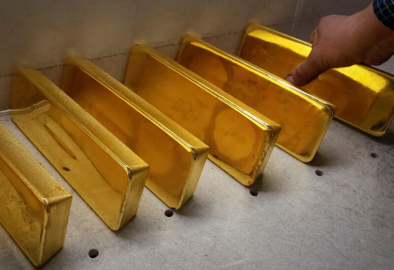 An employee stores newly casted ingots of 99.99 percent pure gold after weighing at the Krastsvetmet non-ferrous metals plant, one of the world's largest producers in the precious metals industry, in the Siberian city of Krasnoyarsk, Russia November 22, 2018. REUTERS/Ilya Naymushin