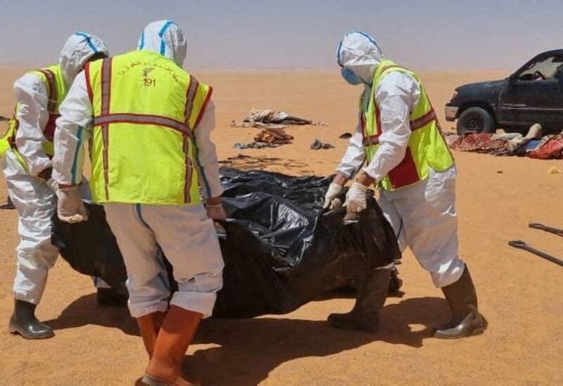 Security personnel recover the body of a migrant in the area between Kufra city and Chadian border with Libya June 28, 2022. Courtesy of Kufra ambulance service head Ibrahim Belhasan /Handout via REUTERS