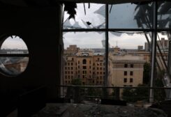 The skyline of the city centre can be seen through a destroyed office building that was hit by shelling, the area hadn’t been hit in weeks, as Russia’s attack on Ukraine continues in Kharkiv, Ukraine, June 25, 2022. REUTERS/Leah Millis