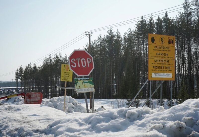 Road signs are seen at the Imatra border crossing with Russia