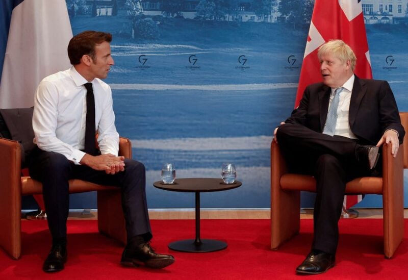 French President Emmanuel Macron and British Prime Minister Boris Johnson hold a bilateral meeting during a G7 leaders summit at Bavaria's Schloss Elmau castle, near Garmisch-Partenkirchen, Germany June 26, 2022. REUTERS/Benoit Tessier/Pool