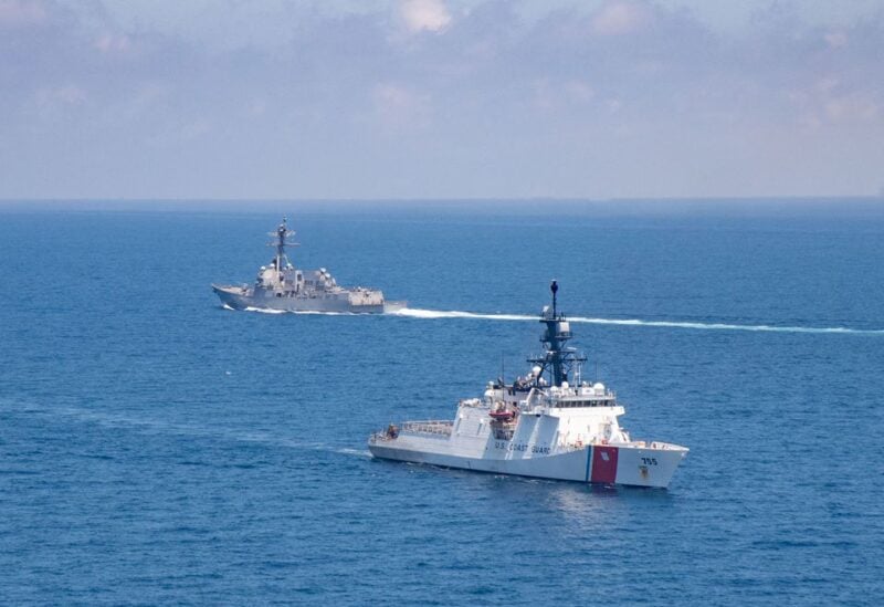 The Arleigh Burke-class guided-missile destroyer USS Kidd and U.S. Coast Guard cutter Munro conduct Taiwan Strait transits