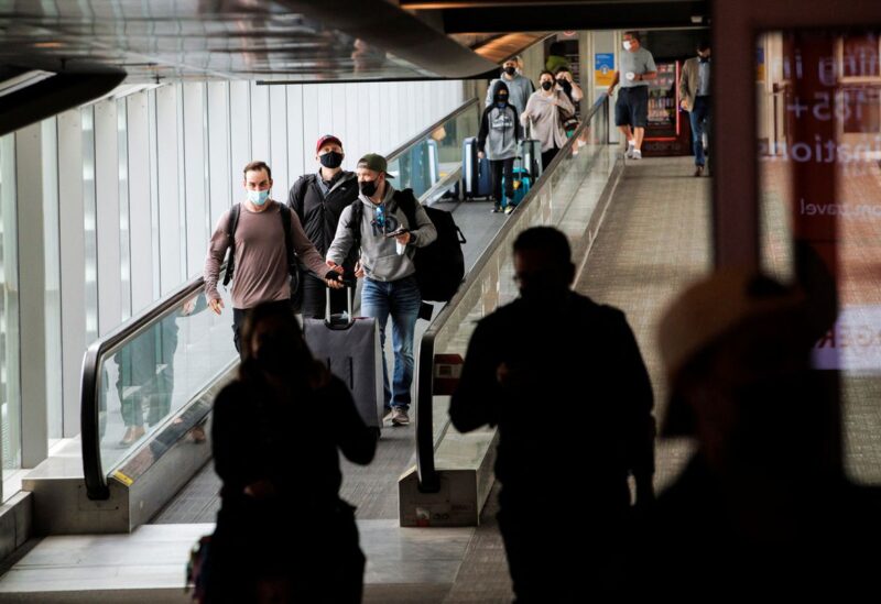 Travellers make their way to the departures terminal at the start of the Victoria Day holiday long weekend at Toronto Pearson International Airport in Mississauga, Ontario, Canada, May 20, 2022. REUTERS/Cole Burston