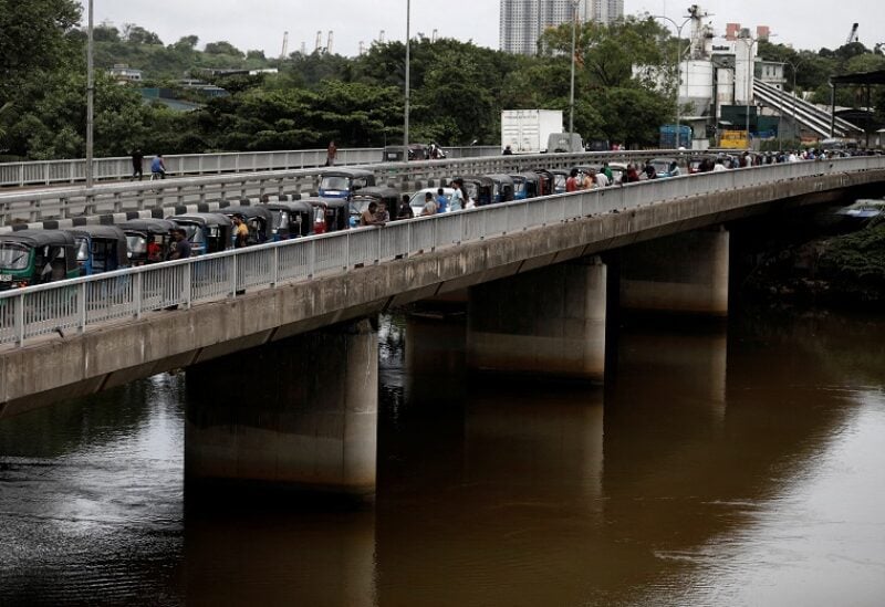 Three-wheeler drivers wait in a queue to buy petrol due to fuel shortage, amid the country's economic crisis, in Colombo Sri Lanka, June 17, 2022. REUTERS/Dinuka Liyanawatte