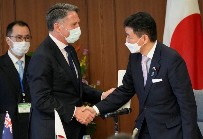 Australian Defence Minister Richard Marles and Japanese Defence Minister Nobuo Kishi shake hands after a joint news conference at the Ministry of Defence in Tokyo, Japan June 15, 2022. Shuji Kajiyama/Pool via REUTERS