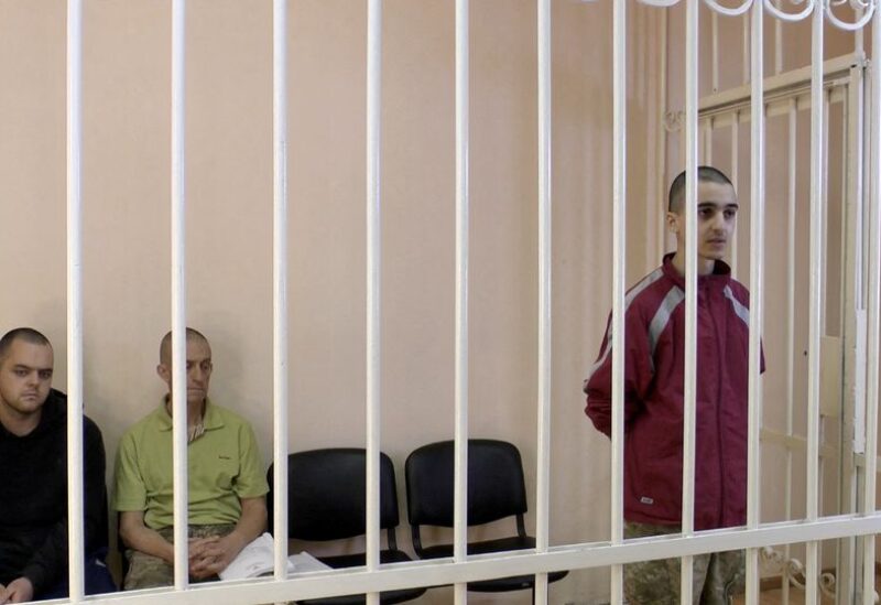 A still image, taken from footage of the Supreme Court of the self-proclaimed Donetsk People's Republic, shows Britons Aiden Aslin, Shaun Pinner and Moroccan Brahim Saadoun captured by Russian forces during a military conflict in Ukraine