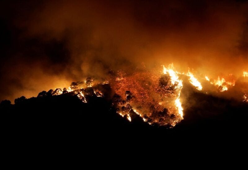 A forest fire is seen in Benahavis, Spain. June 8, 2022. REUTERS/Jon Nazca