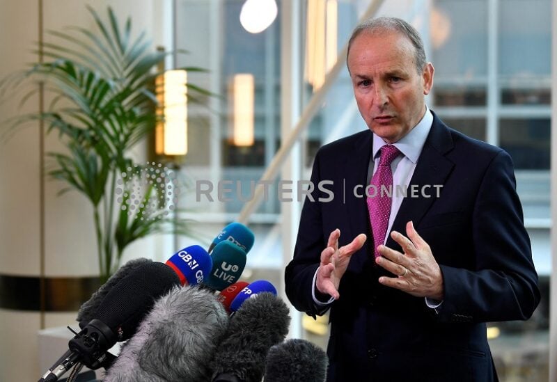 FILE PHOTO: Ireland's (Prime Minister) Taoiseach Micheal Martin speaks to media during a news conference at the Grand Central Hotel after speaking to Northern Ireland party leaders regarding issues surrounding the Northern Ireland protocol and power sharing impasse, in Belfast, Northern Ireland, May 20, 2022. REUTERS/Clodagh Kilcoyne