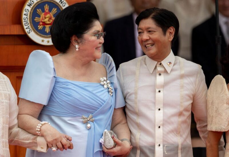 Former first lady of Philippines Imelda Marcos smiles with her son and newly-elected Phillippines President Ferdinand "Bongbong" Marcos Jr.