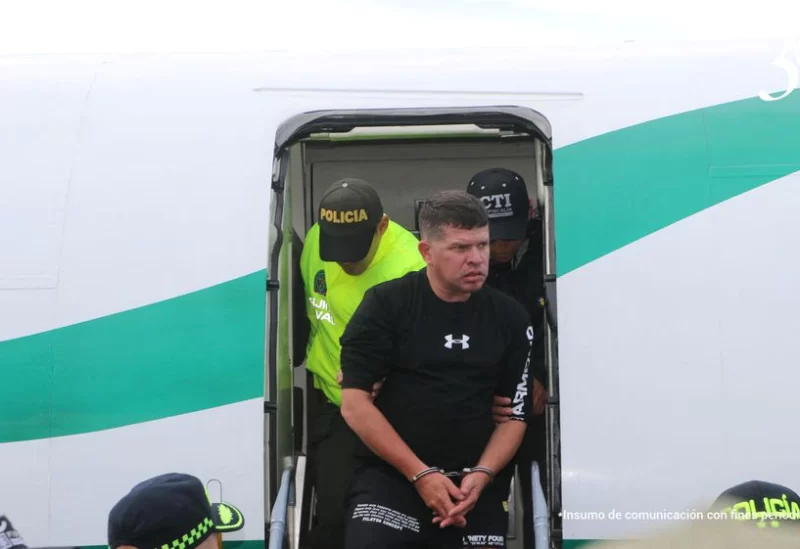 Francisco Luis Correa Galeano, who according to authorities, is one of those implicated in the murder of Paraguayan prosecutor Marcelo Pecci, is escorted by Colombian police after his capture in Cartagena, Colombia